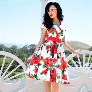 PUG Birdie dress. White with red floral print.